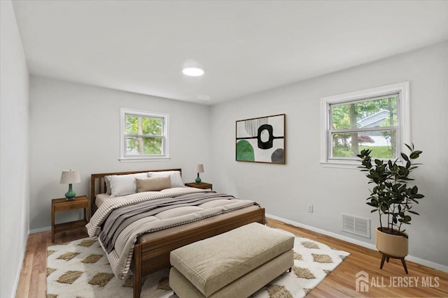 376 New Brunswick Ave, East Brunswick, NJ 08816 - bedroom with wood finished floors and baseboards