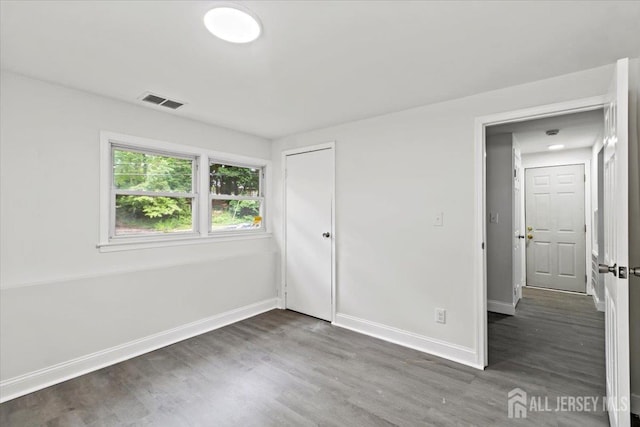 376 New Brunswick Ave, East Brunswick, NJ 08816 - unfurnished bedroom featuring wood finished floors and a closet