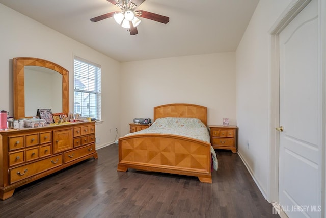 bedroom with dark wood finished floors, baseboards, and a ceiling fan