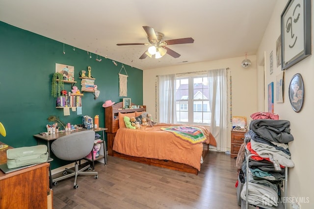 bedroom featuring wood finished floors and ceiling fan