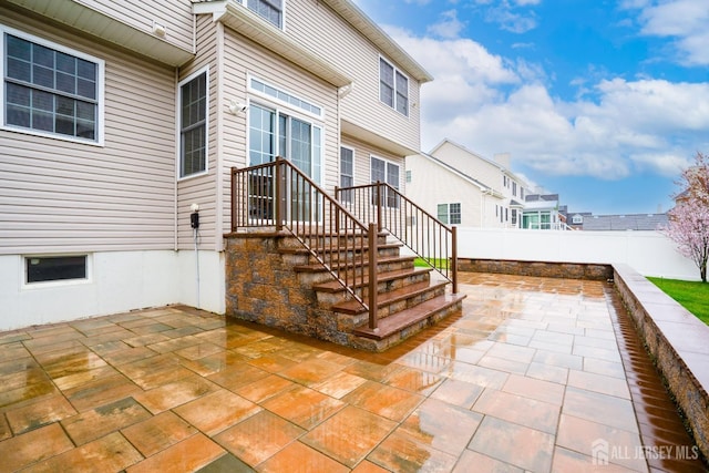 view of patio featuring fence