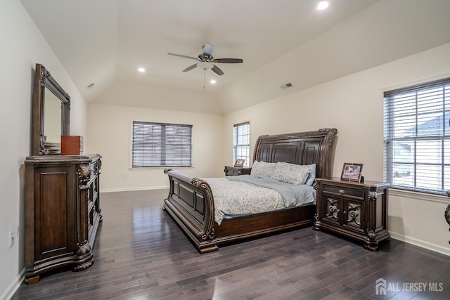 bedroom featuring multiple windows, lofted ceiling, dark wood-style floors, baseboards, and recessed lighting