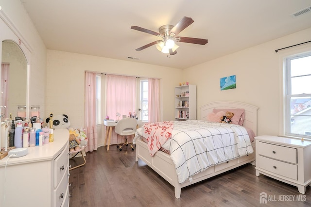 bedroom with dark wood finished floors and a ceiling fan