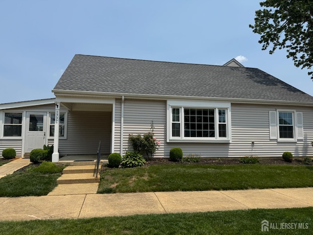 177-C Rossmoor Dr Unit 177C, Monroe, NJ 08831 - view of front facade featuring a shingled roof and a front lawn