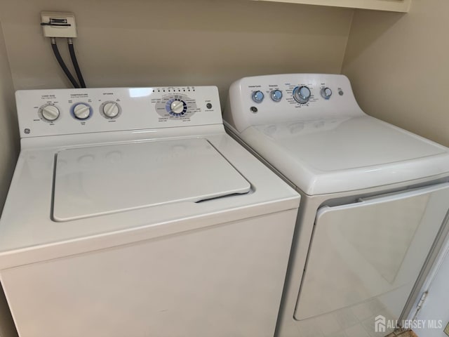 177-C Rossmoor Dr Unit 177C, Monroe, NJ 08831 - washroom featuring separate washer and dryer