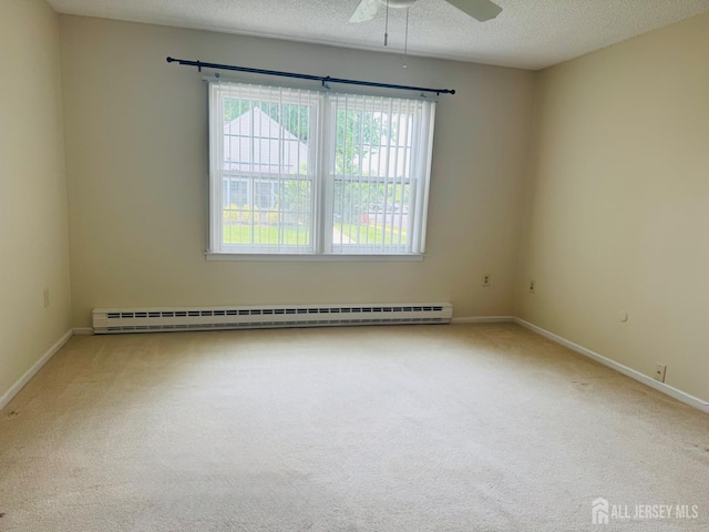177-C Rossmoor Dr Unit 177C, Monroe, NJ 08831 - unfurnished room featuring a baseboard heating unit, carpet floors, ceiling fan, and a textured ceiling