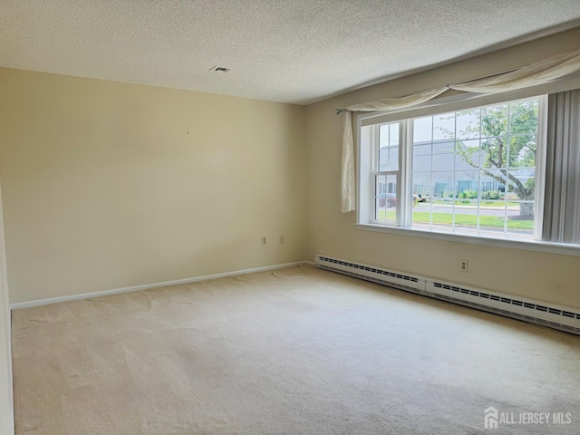 177-C Rossmoor Dr Unit 177C, Monroe, NJ 08831 - carpeted spare room with baseboard heating and a textured ceiling