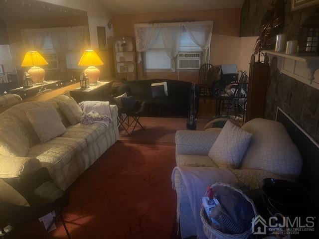 living room with cooling unit, a premium fireplace, and carpet flooring