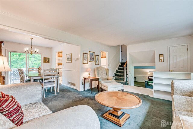200 Elwood St, Piscataway, NJ 08854 - living room with dark carpet, stairway, and a chandelier