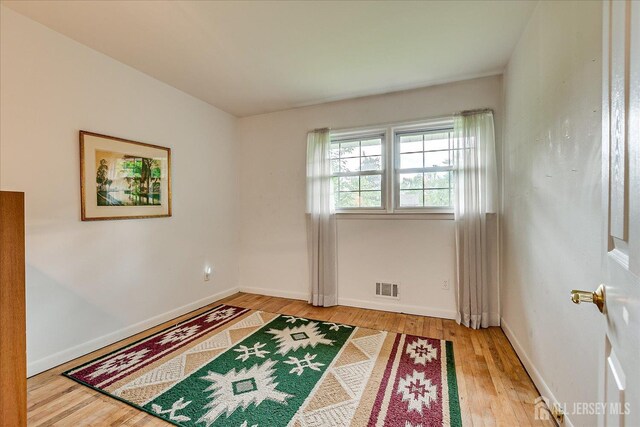 200 Elwood St, Piscataway, NJ 08854 - empty room with wood finished floors and baseboards