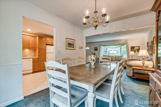 200 Elwood St, Piscataway, NJ 08854 - dining space featuring a chandelier, light carpet, and ornamental molding
