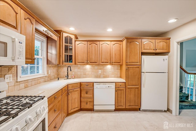 200 Elwood St, Piscataway, NJ 08854 - kitchen with white appliances, a sink, glass insert cabinets, light countertops, and tasteful backsplash