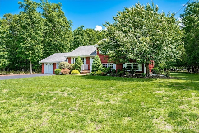 200 Elwood St, Piscataway, NJ 08854 - split level home featuring driveway, a garage, and a front lawn
