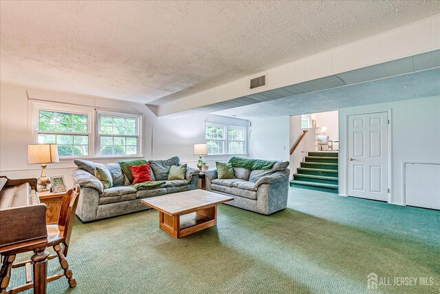 200 Elwood St, Piscataway, NJ 08854 - carpeted living room with a textured ceiling and stairway
