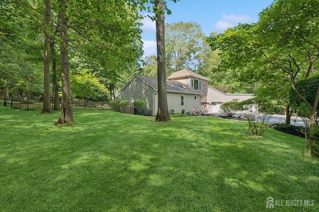 2 Derby Ln, East Brunswick, NJ 08816 - view of yard featuring a garage