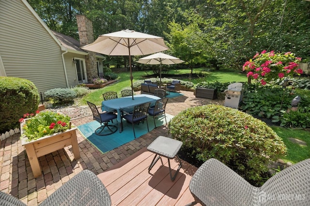 2 Derby Ln, East Brunswick, NJ 08816 - wooden deck with outdoor dining space, a patio, and a lawn