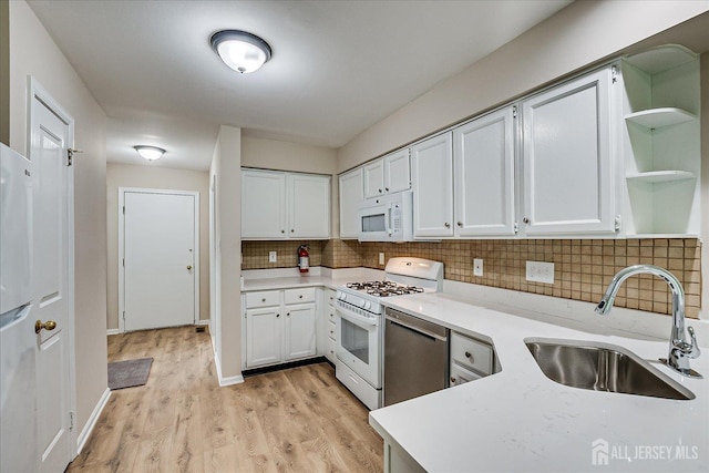 36 Benjamin Rush Ln, Princeton, NJ 08540 - kitchen featuring white appliances, open shelves, light countertops, tasteful backsplash, and white cabinetry