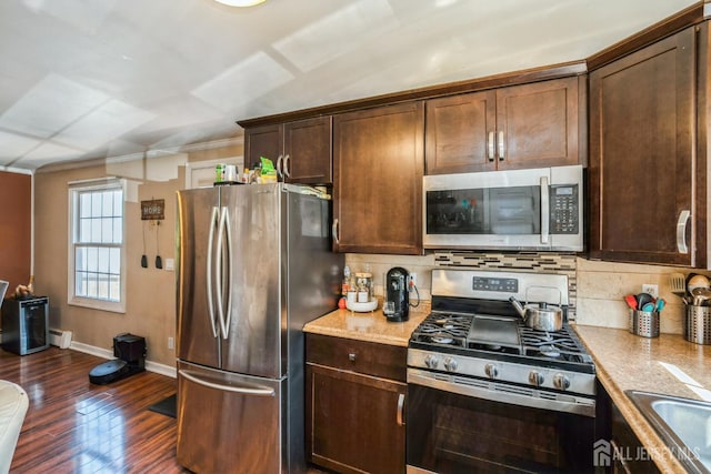 16 Taft Ave, Edison, NJ 08817 - kitchen featuring stainless steel appliances, dark wood-style floors, backsplash, dark brown cabinetry, and ornamental molding