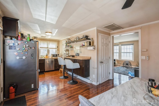 16 Taft Ave, Edison, NJ 08817 - kitchen featuring appliances with stainless steel finishes, dark wood finished floors, ornamental molding, light countertops, and open shelves