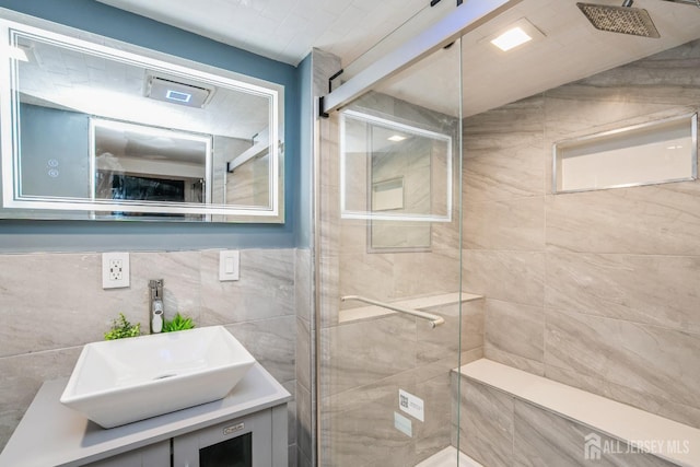 16 Taft Ave, Edison, NJ 08817 - full bath with a shower stall, vanity, and tile walls