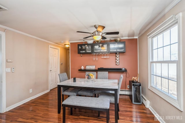 16 Taft Ave, Edison, NJ 08817 - dining area with ornamental molding, dark wood-type flooring, a baseboard radiator, and ceiling fan