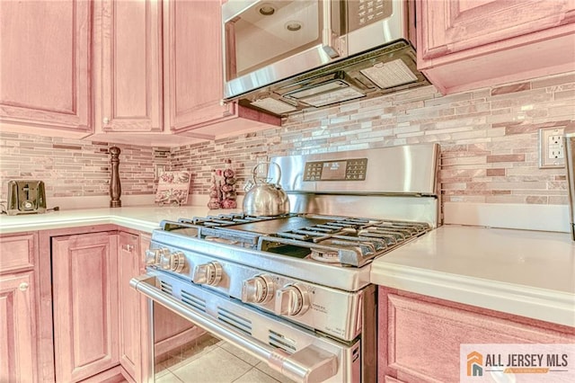 2 Kristen Ct, Franklin, NJ 08873 - kitchen with stainless steel appliances, light countertops, backsplash, and tile patterned floors