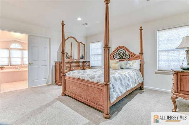 bedroom featuring multiple windows, visible vents, and light colored carpet