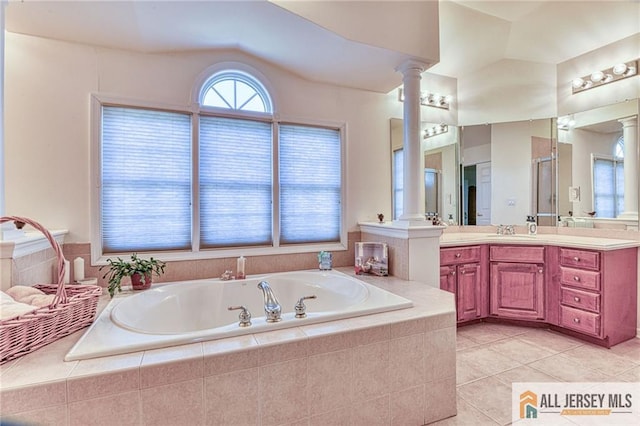 2 Kristen Ct, Franklin, NJ 08873 - full bath with decorative columns, a garden tub, tile patterned floors, vanity, and vaulted ceiling