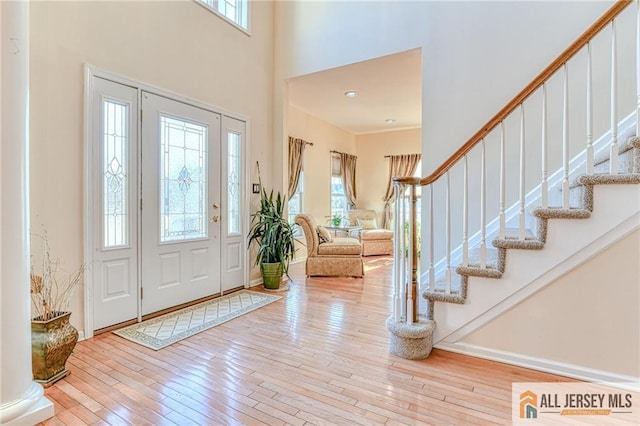 2 Kristen Ct, Franklin, NJ 08873 - foyer entrance with hardwood / wood-style flooring, stairs, and a high ceiling