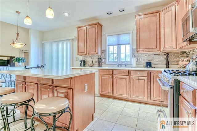 2 Kristen Ct, Franklin, NJ 08873 - kitchen featuring light brown cabinetry, appliances with stainless steel finishes, backsplash, light countertops, and a sink