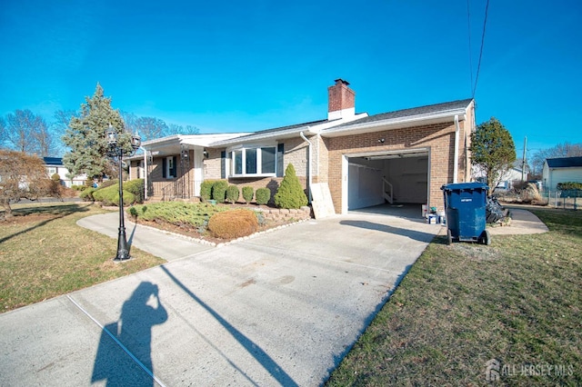 single story home with concrete driveway, a front yard, an attached garage, brick siding, and a chimney