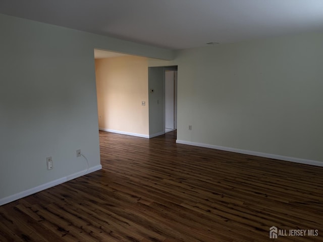 5 Texas Ct Unit B, Old Bridge, NJ 07747 - empty room featuring dark wood-style flooring and baseboards