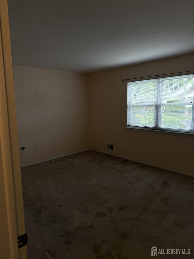 5 Texas Ct Unit B, Old Bridge, NJ 07747 - carpeted empty room with baseboards