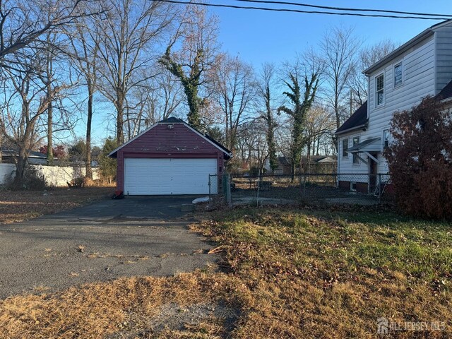 view of property exterior featuring an outbuilding and a garage