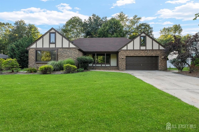 39 Miara St, Sayreville, NJ 08859 - tudor house featuring an attached garage, a front lawn, driveway, and brick siding