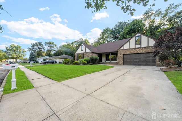 39 Miara St, Sayreville, NJ 08859 - tudor home with a garage, driveway, a front lawn, and brick siding