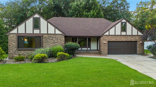 39 Miara St, Sayreville, NJ 08859 - english style home featuring brick siding, concrete driveway, a front yard, an attached garage, and stucco siding