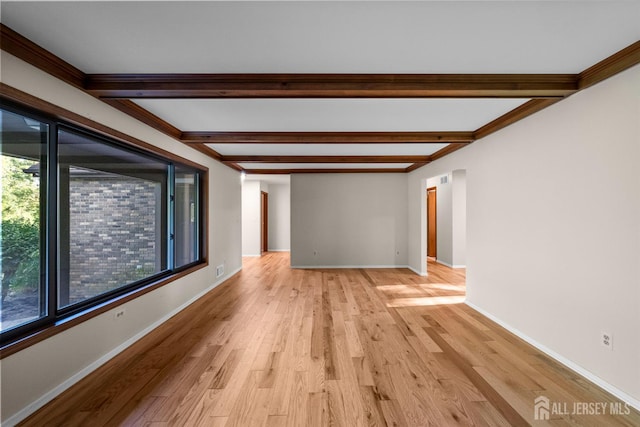39 Miara St, Sayreville, NJ 08859 - spare room with beamed ceiling and light wood-type flooring