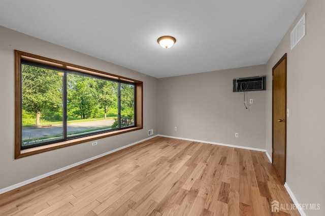 39 Miara St, Sayreville, NJ 08859 - spare room featuring a wall unit AC and light wood finished floors