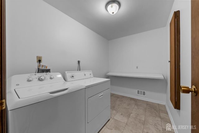 39 Miara St, Sayreville, NJ 08859 - laundry area with washing machine and clothes dryer and baseboards