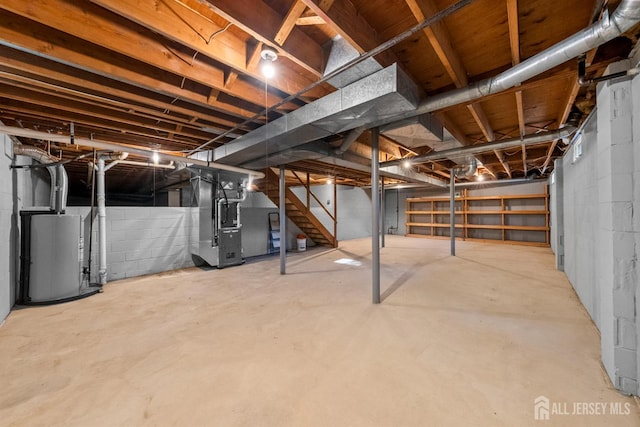 39 Miara St, Sayreville, NJ 08859 - unfinished basement with gas water heater, stairway, and heating unit