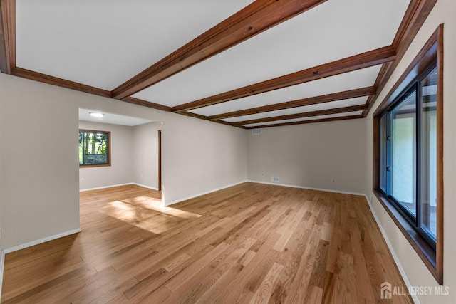 39 Miara St, Sayreville, NJ 08859 - empty room featuring light wood-style flooring and beam ceiling