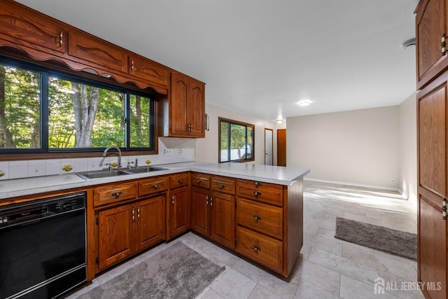 39 Miara St, Sayreville, NJ 08859 - kitchen featuring black dishwasher, a peninsula, brown cabinets, and light countertops
