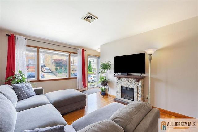 49 Paul St, Fords, NJ 08863 - living area featuring a fireplace and wood finished floors