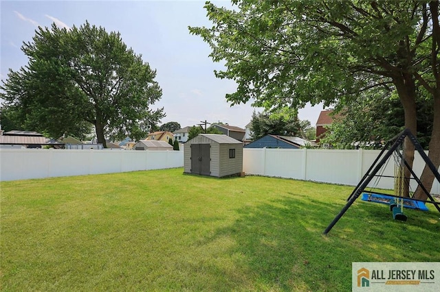49 Paul St, Fords, NJ 08863 - fenced backyard featuring a storage shed and a residential view