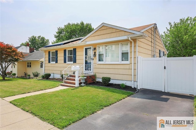 49 Paul St, Fords, NJ 08863 - view of front of home featuring a gate and solar panels
