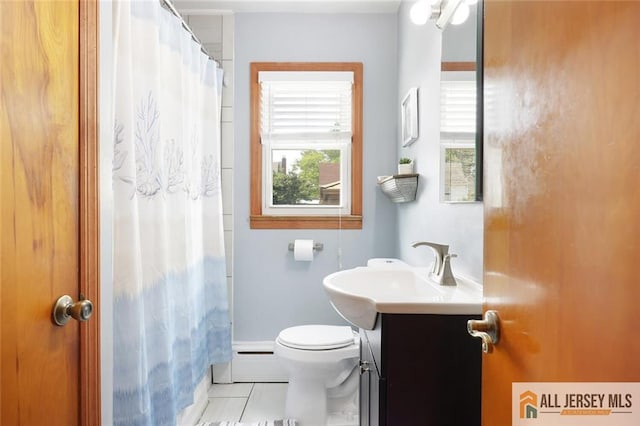 49 Paul St, Fords, NJ 08863 - full bath featuring a baseboard radiator, vanity, tile patterned flooring, and curtained shower