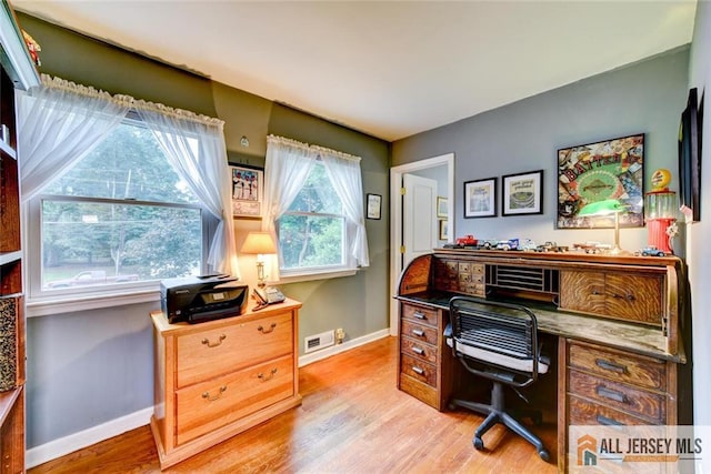 office space with light hardwood / wood-style flooring