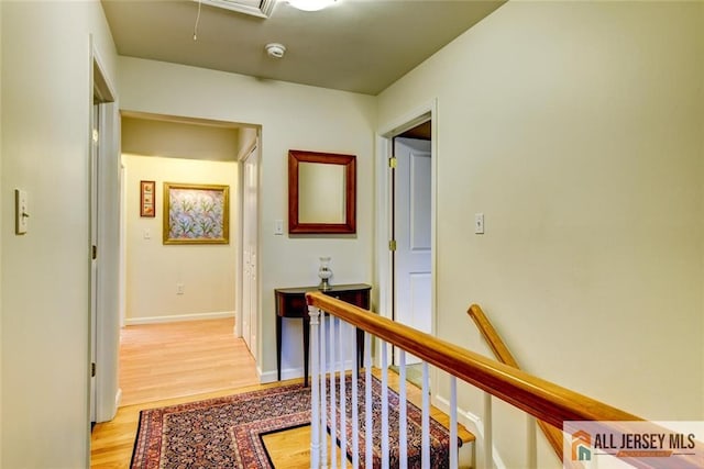 hall with light hardwood / wood-style flooring