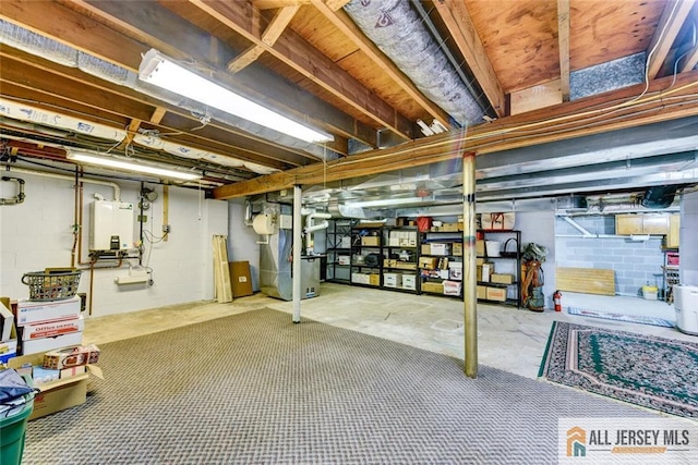 basement featuring heating unit and water heater